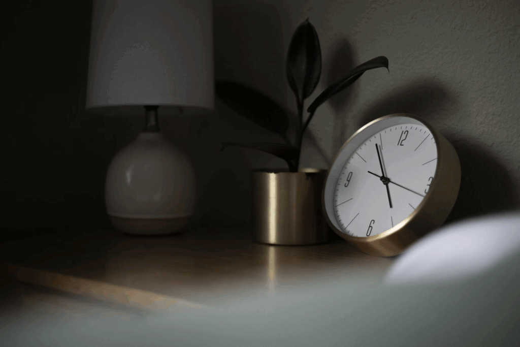 Bedside clock showing nighttime hours, emphasizing the importance of quality sleep for cardiovascular health.
